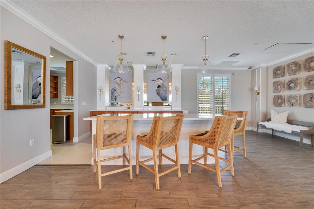 6350 Water Crest Way, Unit 203 Lakewood Ranch, FL 34202 - Photo 32 of 45 a dining room with furniture and window