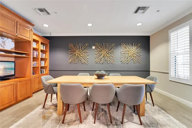 a view of a dining room with furniture and window