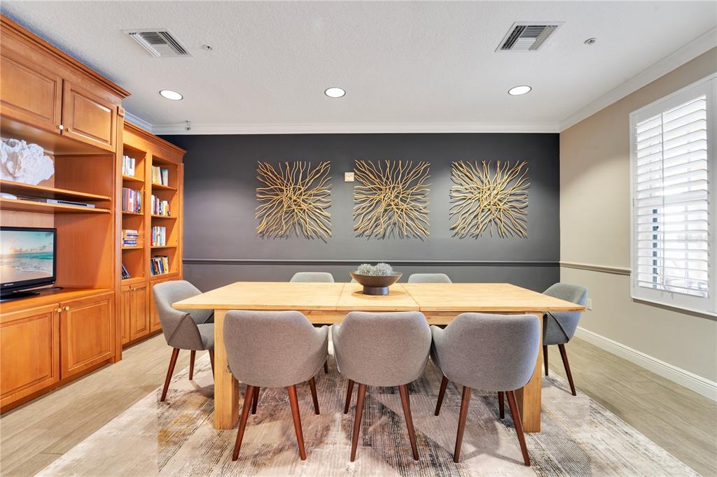6350 Water Crest Way, Unit 203 Lakewood Ranch, FL 34202 - Photo 34 of 45 a view of a dining room with furniture and window