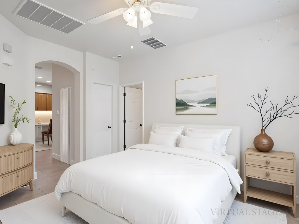 1858 Nelson Ranch Loop Cedar Park, TX 78613 - Photo 14 of 32 Bedroom featuring arched walkways, tile patterned flooring, and a ceiling fan