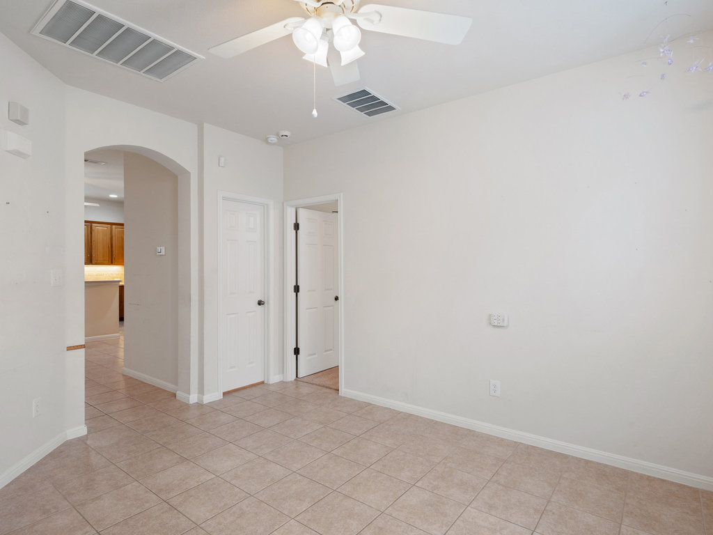 1858 Nelson Ranch Loop Cedar Park, TX 78613 - Photo 15 of 32 Spare room featuring arched walkways and light tile patterned floors