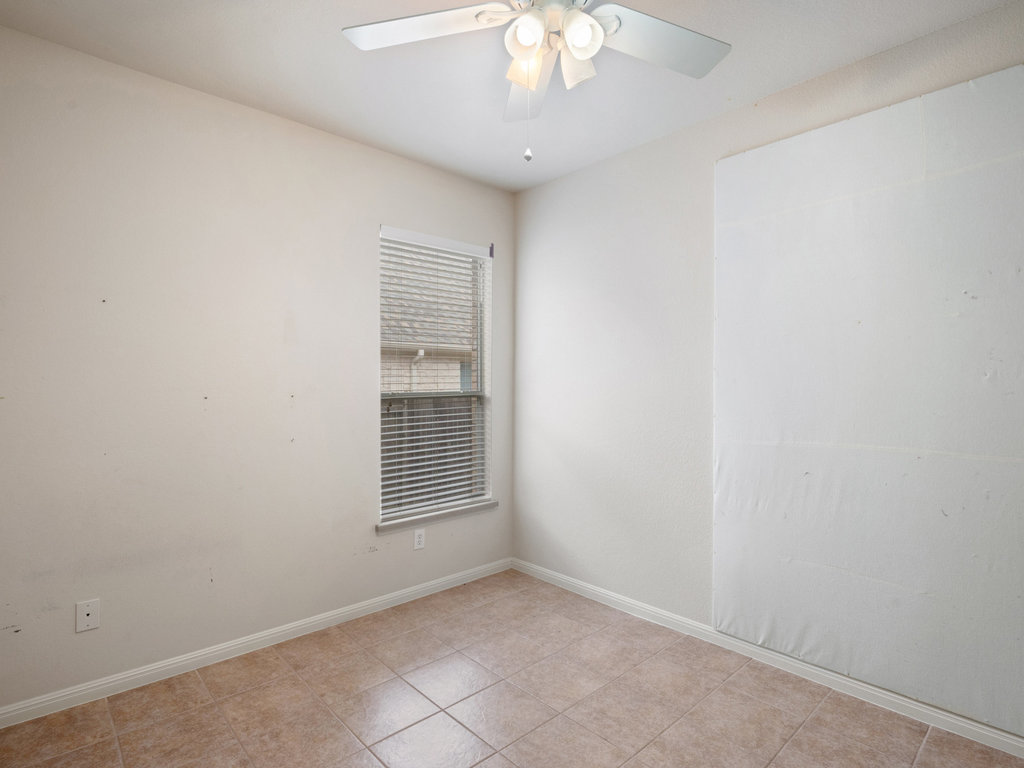 1858 Nelson Ranch Loop Cedar Park, TX 78613 - Photo 16 of 32 Spare room with baseboards and light tile patterned floors