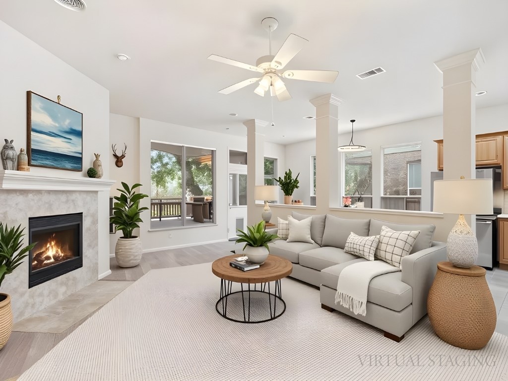 1858 Nelson Ranch Loop Cedar Park, TX 78613 - Photo 4 of 32 Living area featuring healthy amount of natural light, a tile fireplace, light wood-style floors, a ceiling fan, and recessed lighting