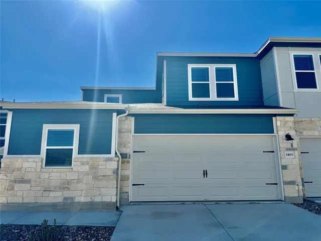 a view of a house with a garage