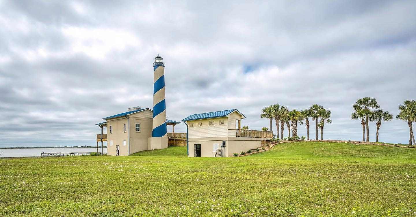 3513 Pelican Way Palacios, TX 77465 - Photo 8 of 9 a front view of a house with a garden