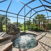 a view of a backyard with sitting area
