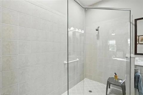 a bathroom with a shower and a sink