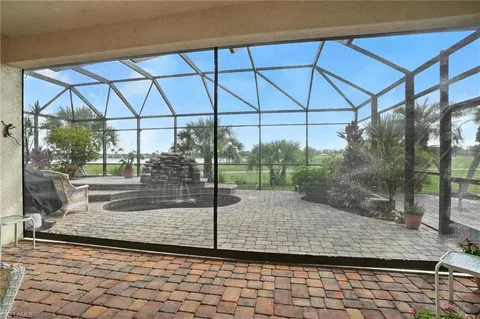 a house with swimming pool in front of it