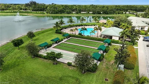 an aerial view of a house with a swimming pool