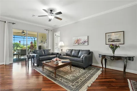 a living room with furniture rug and window