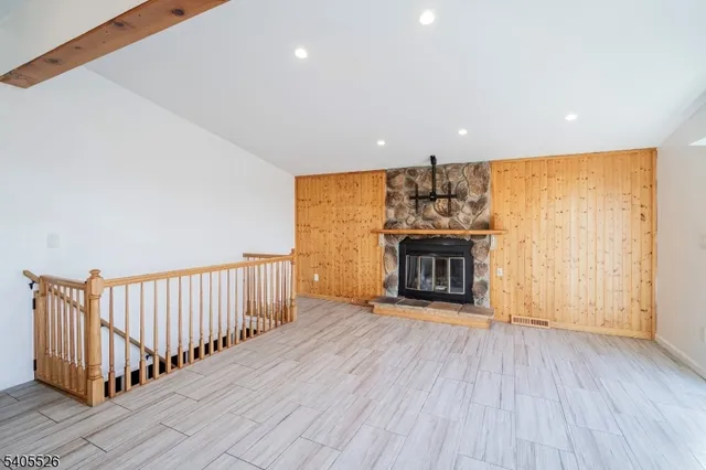 a view of a livingroom with a ceiling fan and window