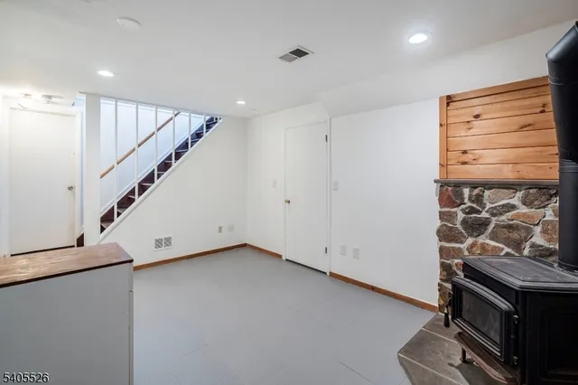 a view of a house with a yard covered in snow