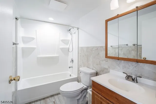 a view of a house with large trees