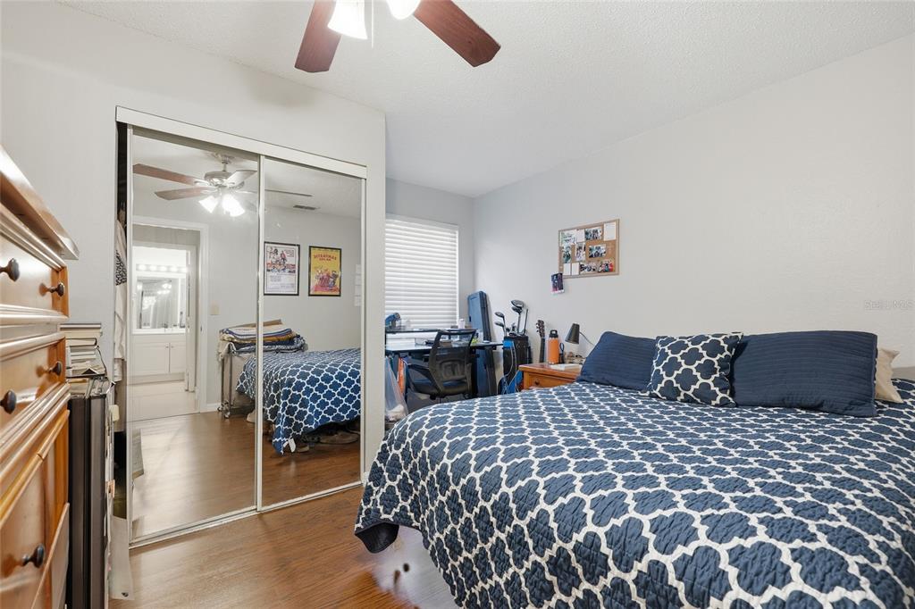 3705 Southwest 27th Street, Unit 717 Gainesville, FL 32608 - Photo 13 of 24 a bedroom with a bed and balcony view