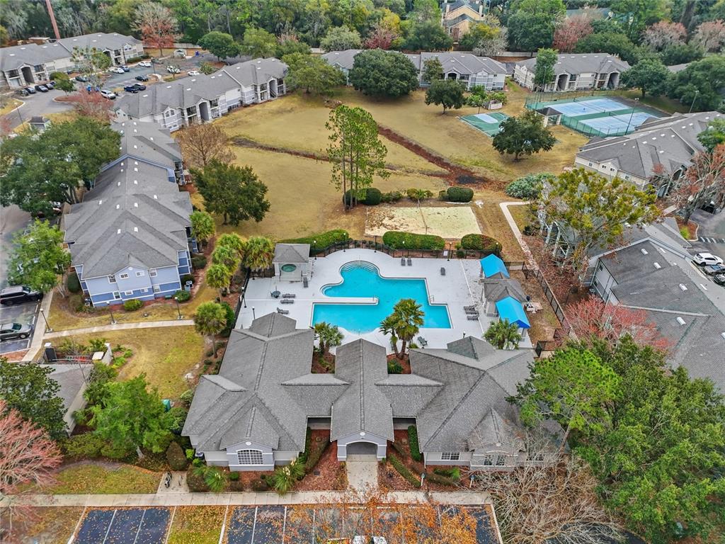 3705 Southwest 27th Street, Unit 717 Gainesville, FL 32608 - Photo 18 of 24 an aerial view of residential house with outdoor space and swimming pool