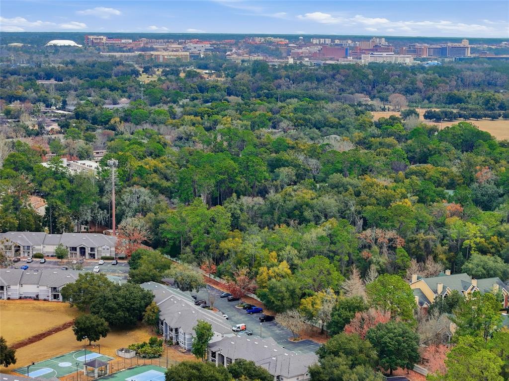 3705 Southwest 27th Street, Unit 717 Gainesville, FL 32608 - Photo 22 of 24 an aerial view of a city with lots of residential buildings
