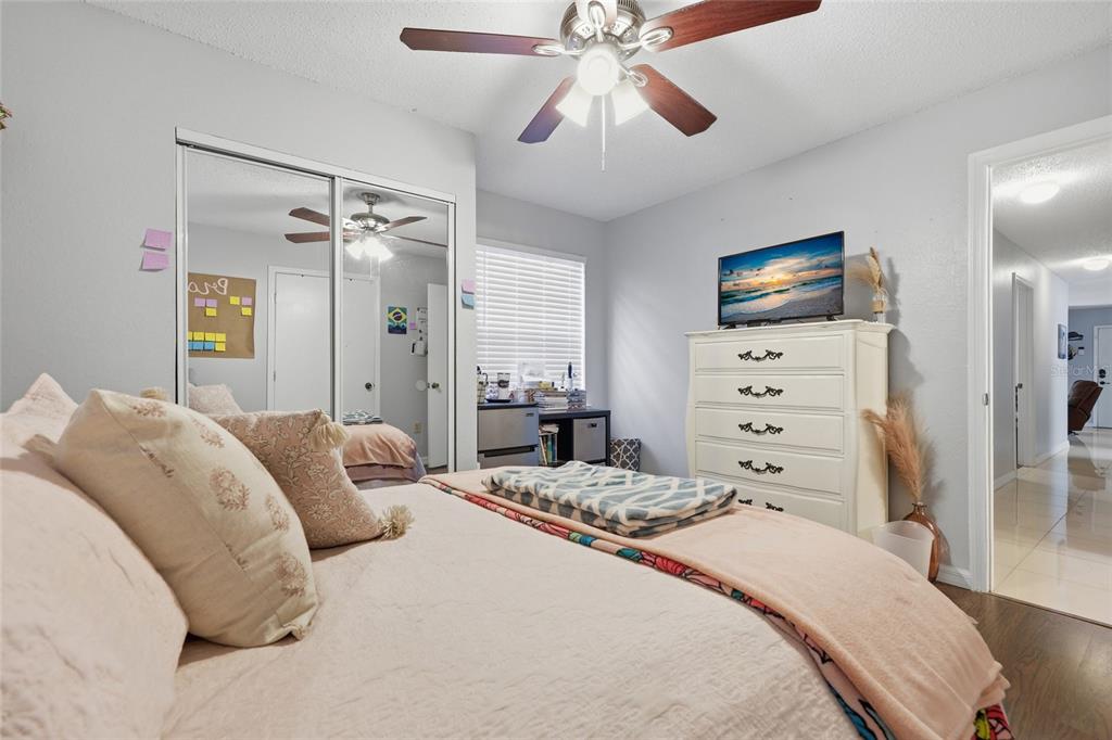 3705 Southwest 27th Street, Unit 717 Gainesville, FL 32608 - Photo 10 of 24 a bedroom with a bed and a flat screen tv