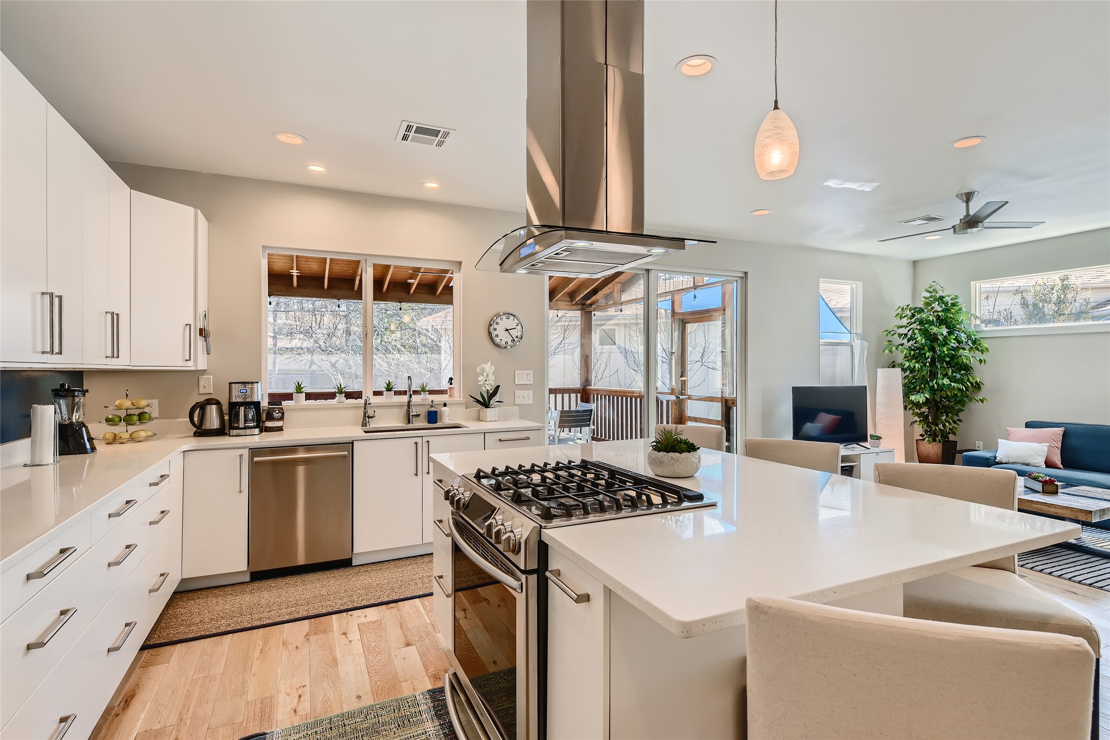 a kitchen with stainless steel appliances kitchen island granite countertop a sink and cabinets
