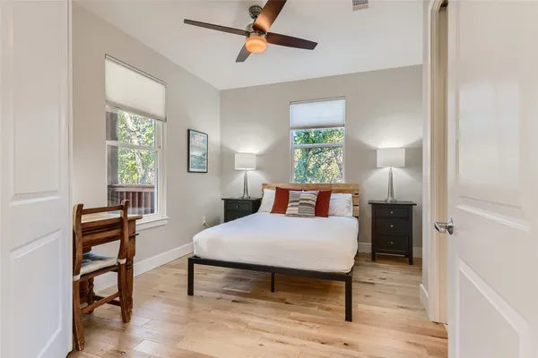 a bedroom with a bed and a window