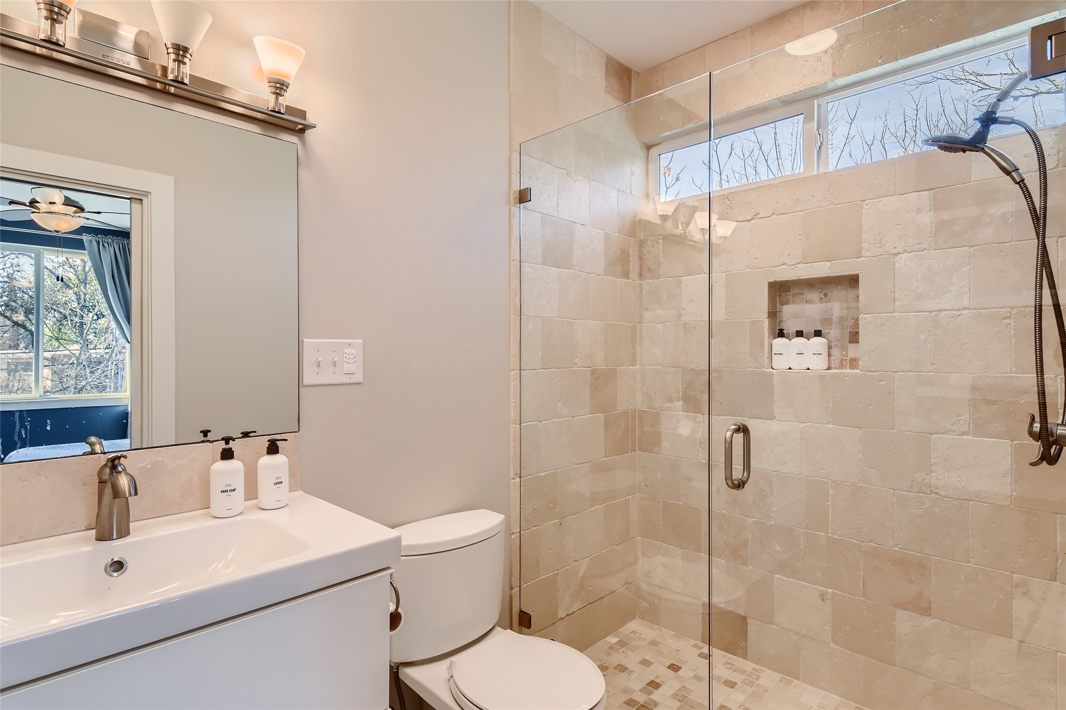 1205 Enfield Road Austin, TX 78703 - Photo 13 of 34 a bathroom with a sink mirror toilet and shower