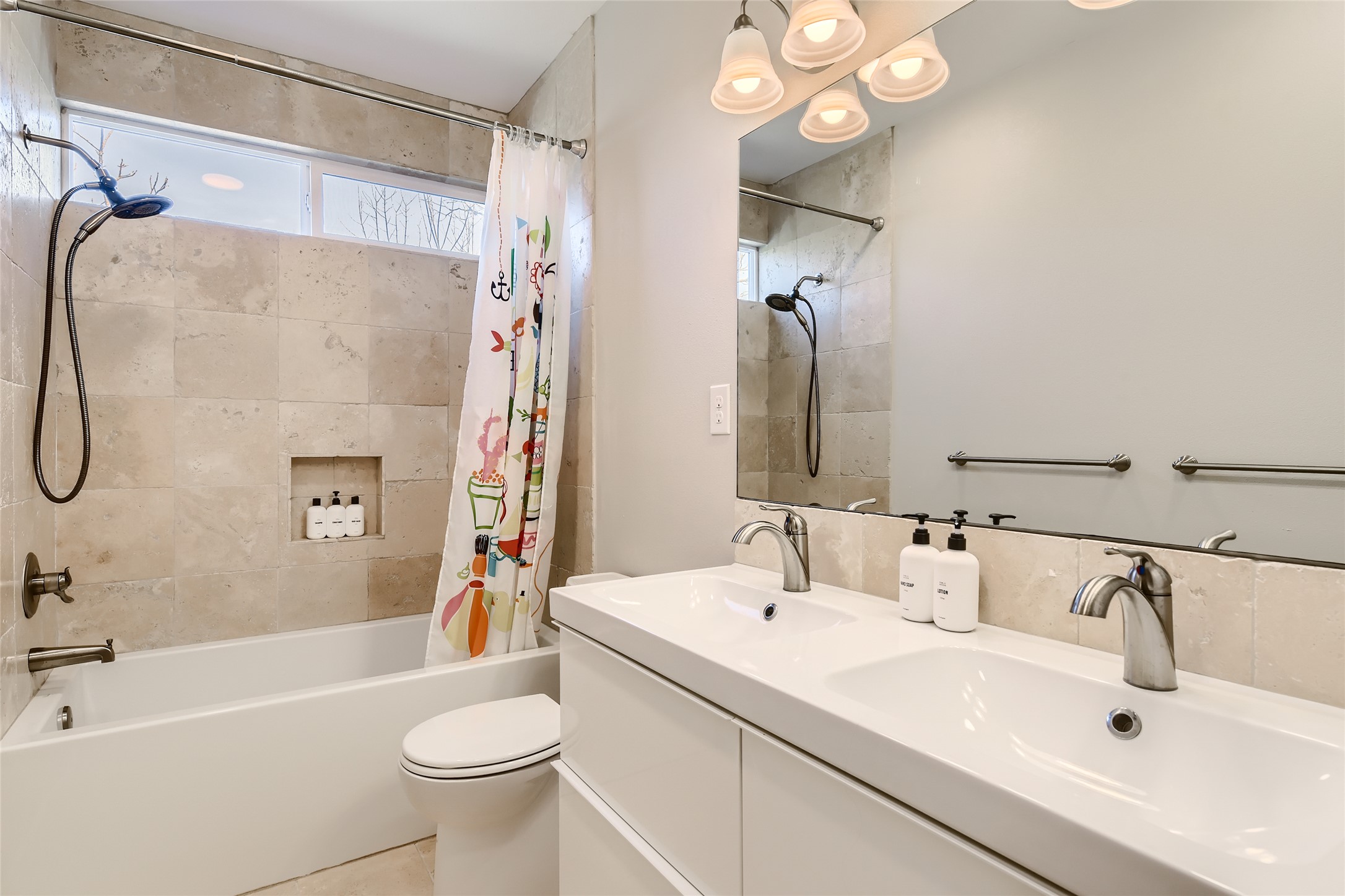 1205 Enfield Road Austin, TX 78703 - Photo 15 of 34 a bathroom with a sink a toilet and shower