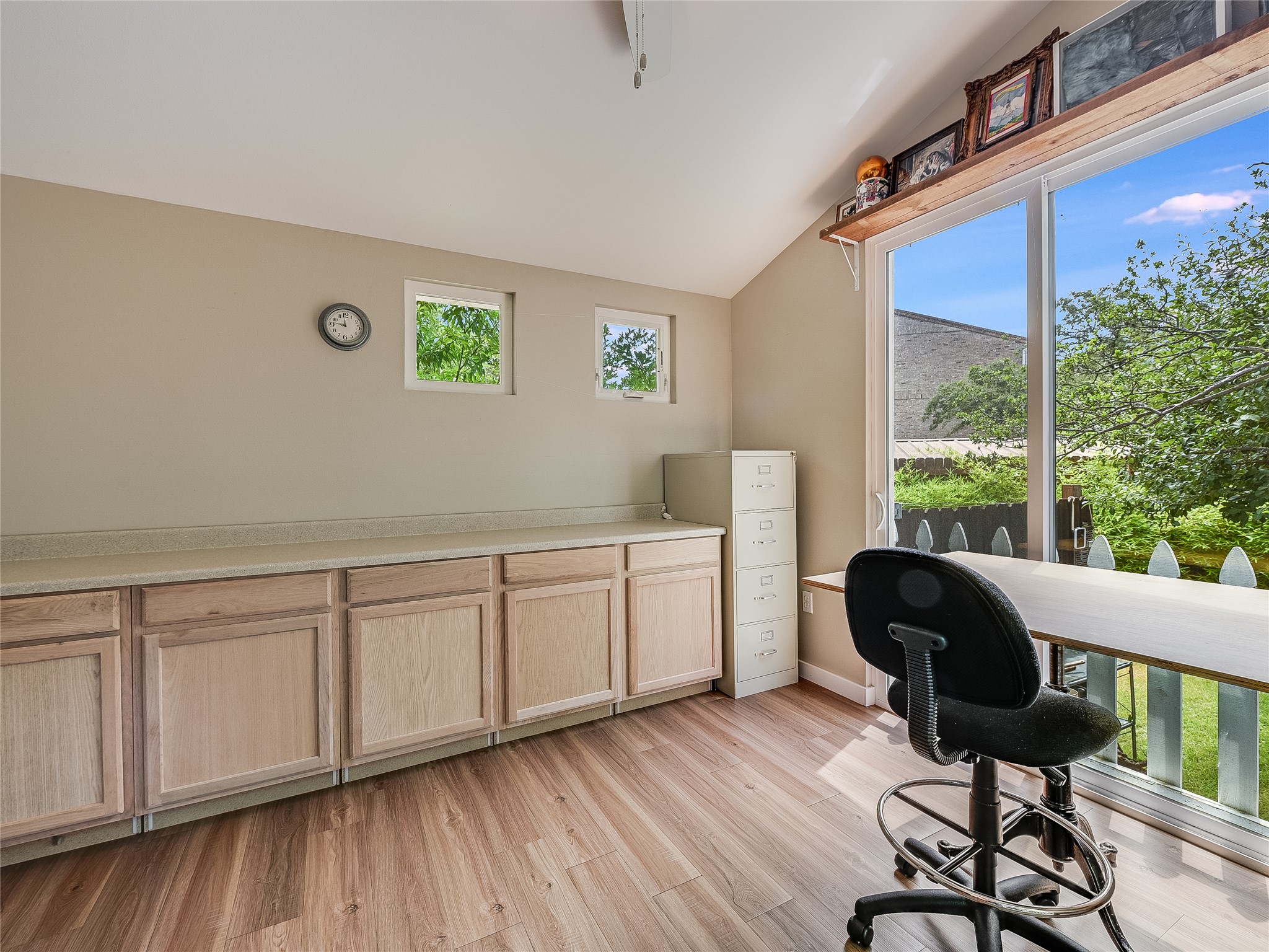 1205 Enfield Road Austin, TX 78703 - Photo 20 of 34 a view of a workspace with furniture and a window