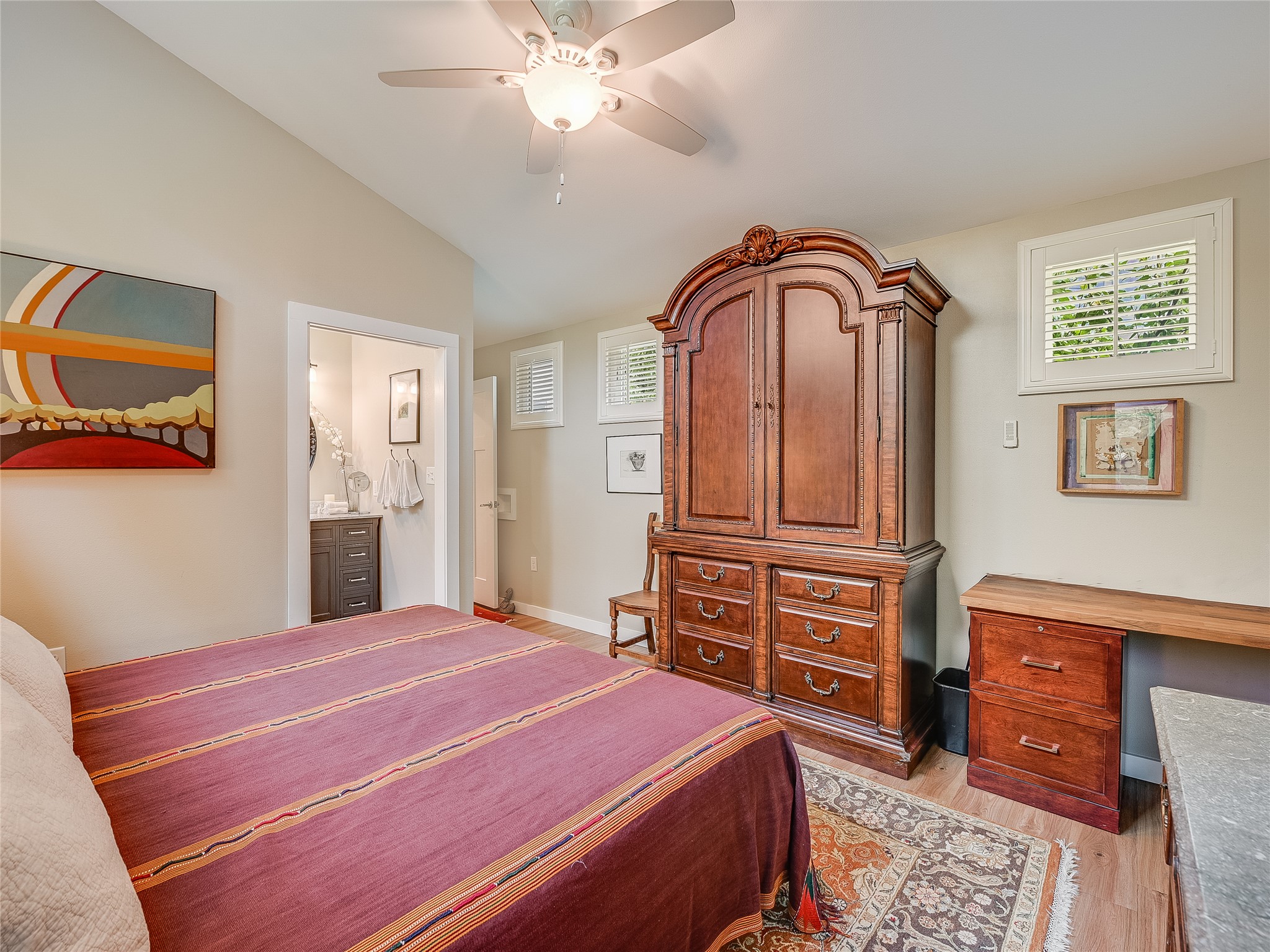 1205 Enfield Road Austin, TX 78703 - Photo 22 of 34 a bedroom with a bed and a dresser