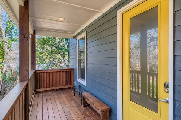 a view of a porch with wooden floor and outdoor space