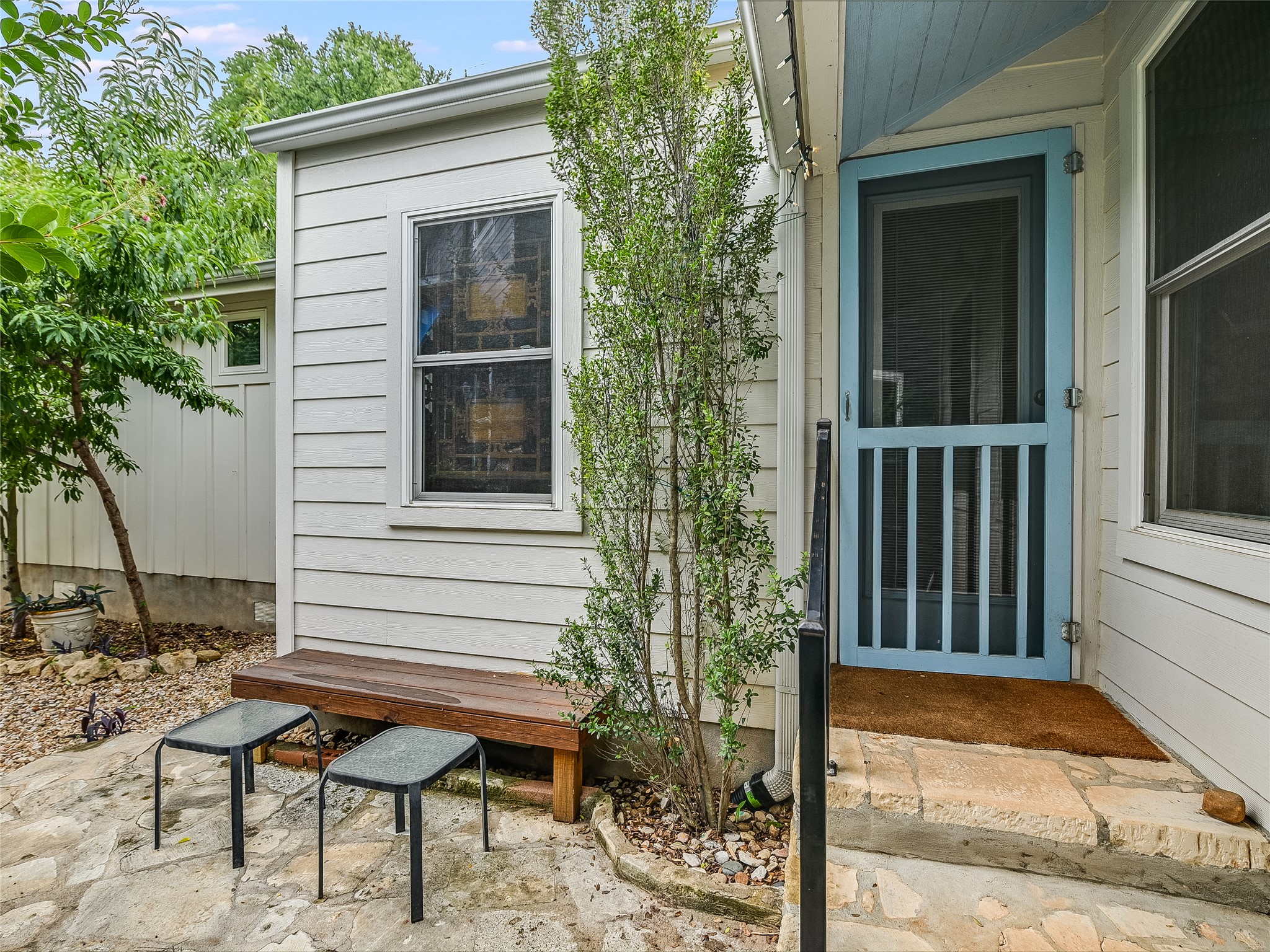 1205 Enfield Road Austin, TX 78703 - Photo 33 of 34 a view of a wooden bench sitting in front of a house