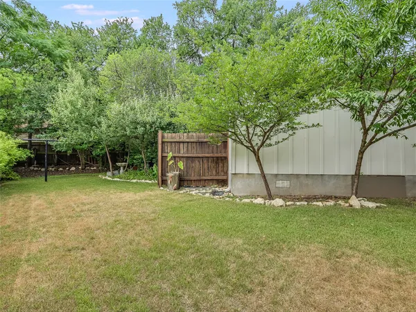 a house with a tree in front of it