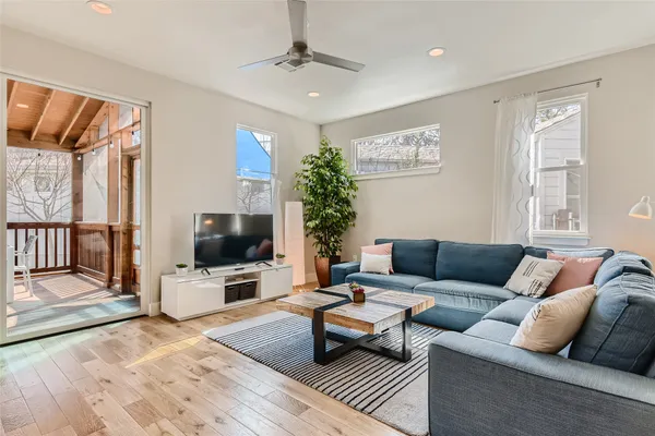 a living room with furniture and a flat screen tv