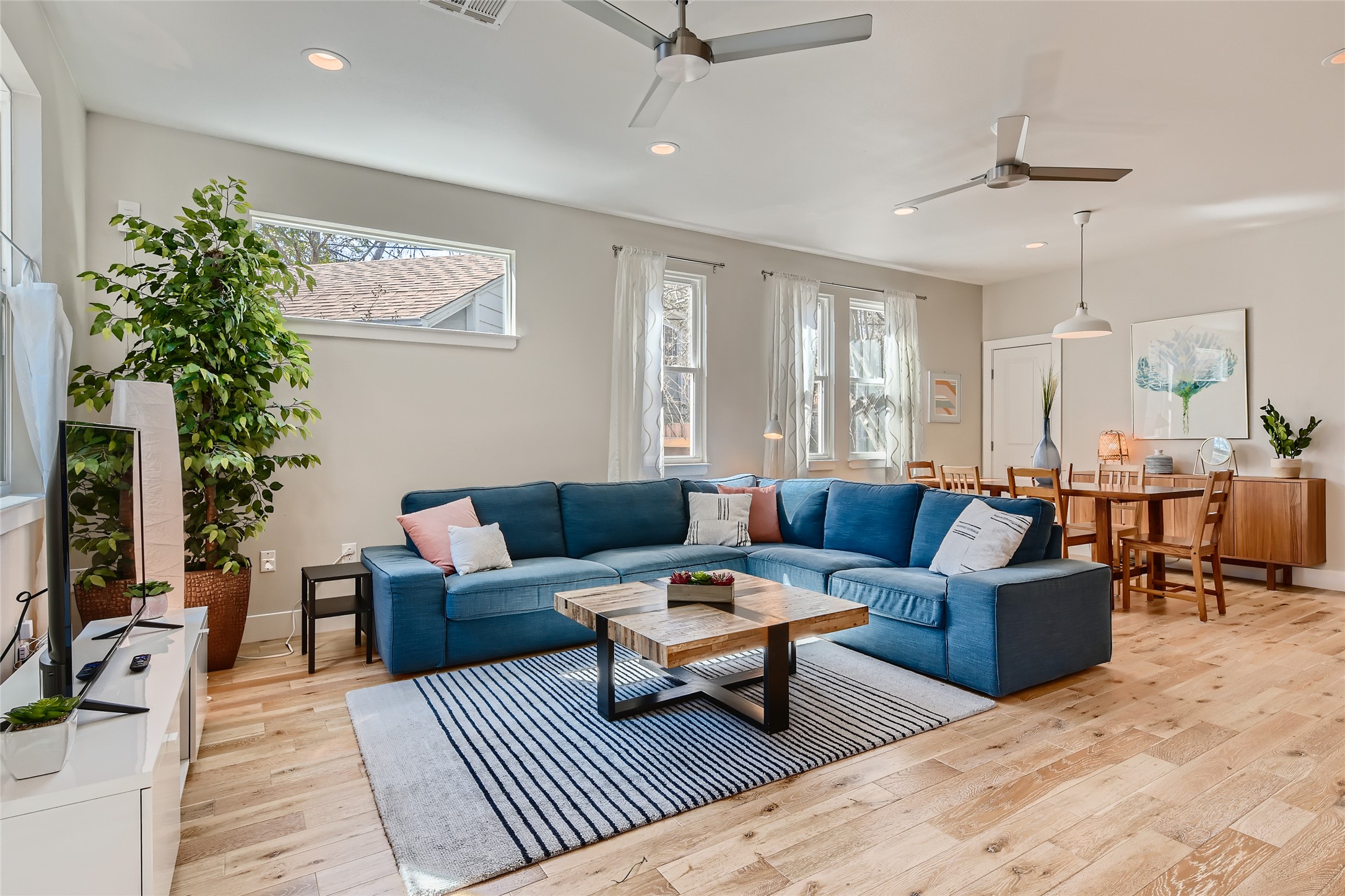 1205 Enfield Road Austin, TX 78703 - Photo 6 of 34 a living room with furniture and a potted plant