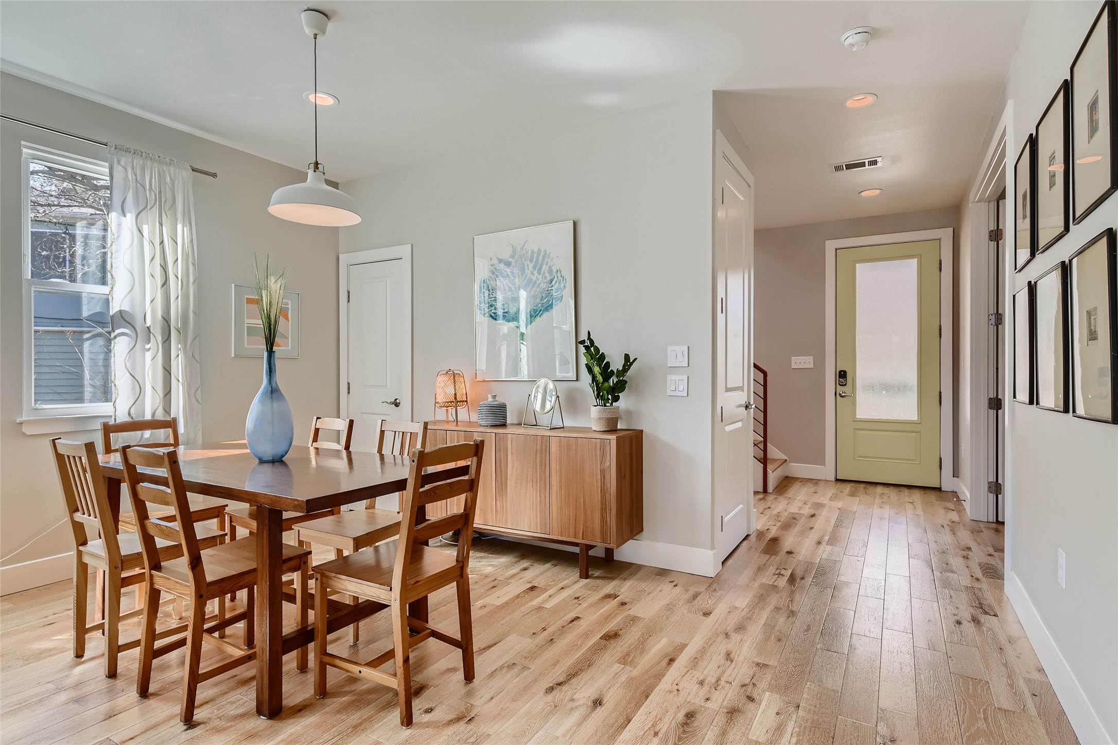 1205 Enfield Road Austin, TX 78703 - Photo 7 of 34 a view of a dining room with furniture window and wooden floor