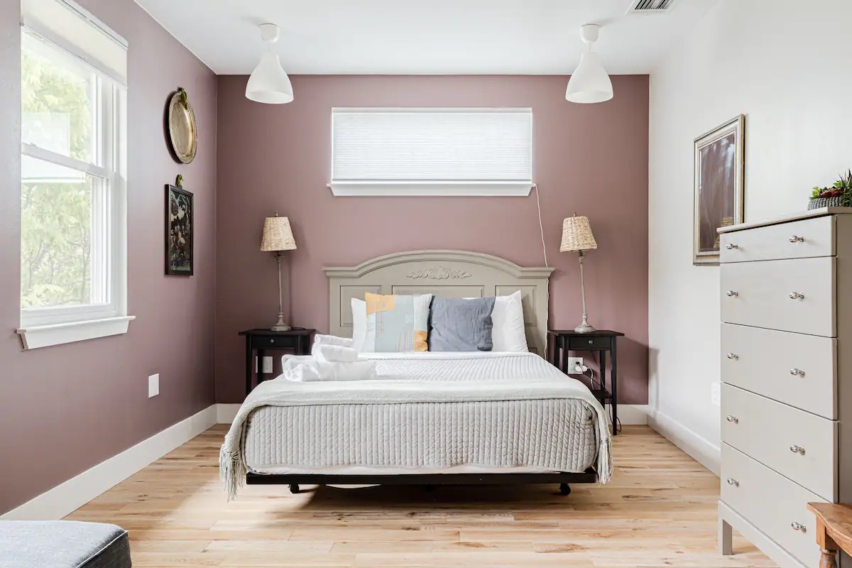 1205 Enfield Road Austin, TX 78703 - Photo 9 of 34 a bedroom with a bed and a window