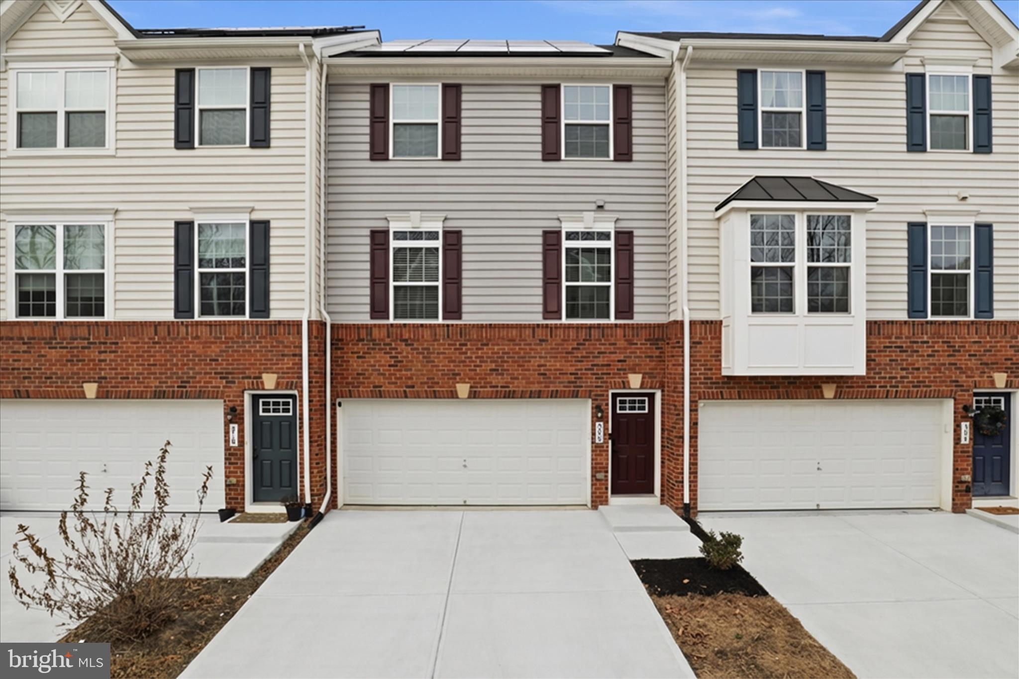 a front view of a building with many windows