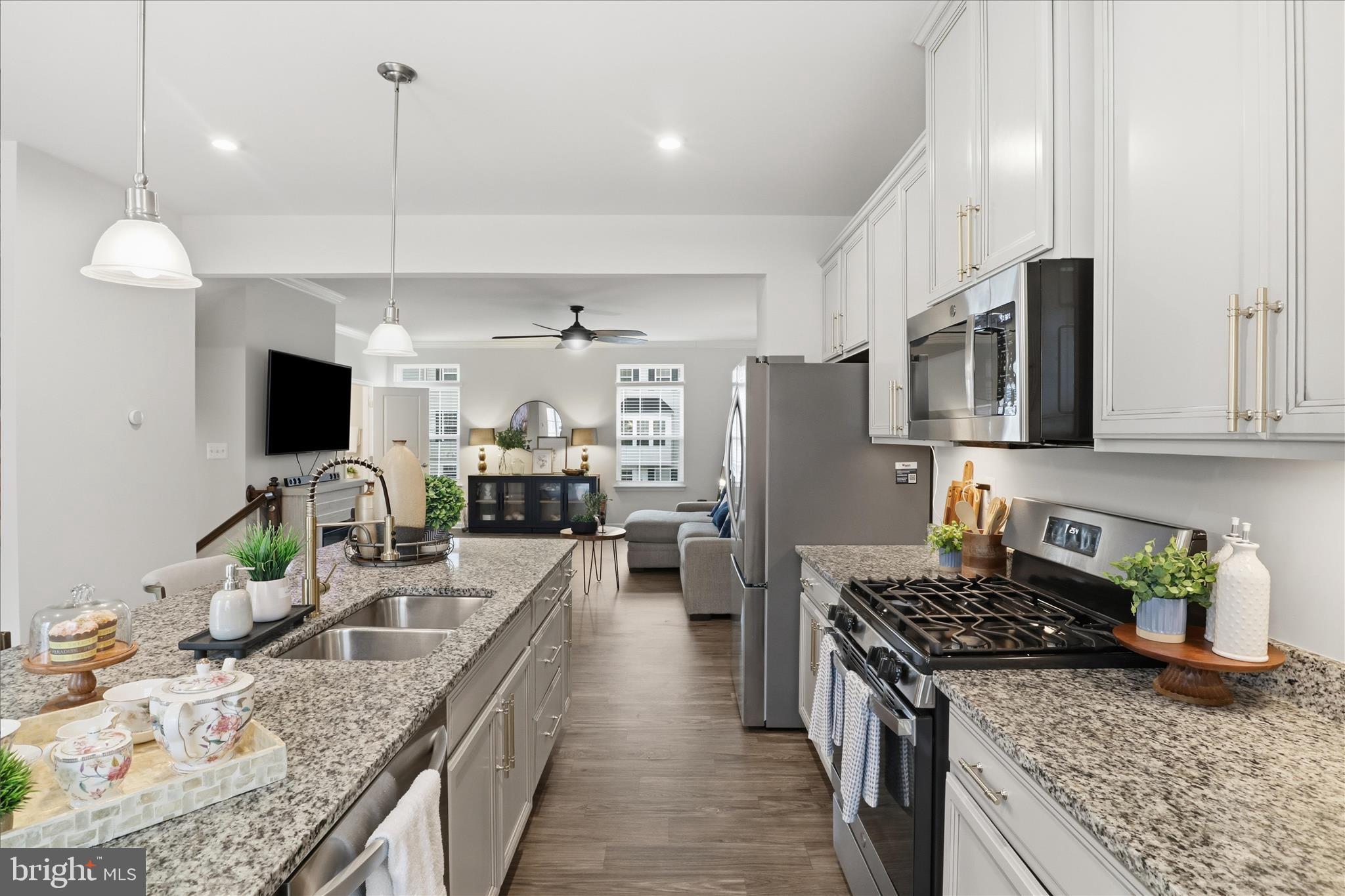 506 View Point Way Fredericksburg, VA 22405 - Photo 12 of 39 a kitchen with stainless steel appliances granite countertop a sink stove and refrigerator