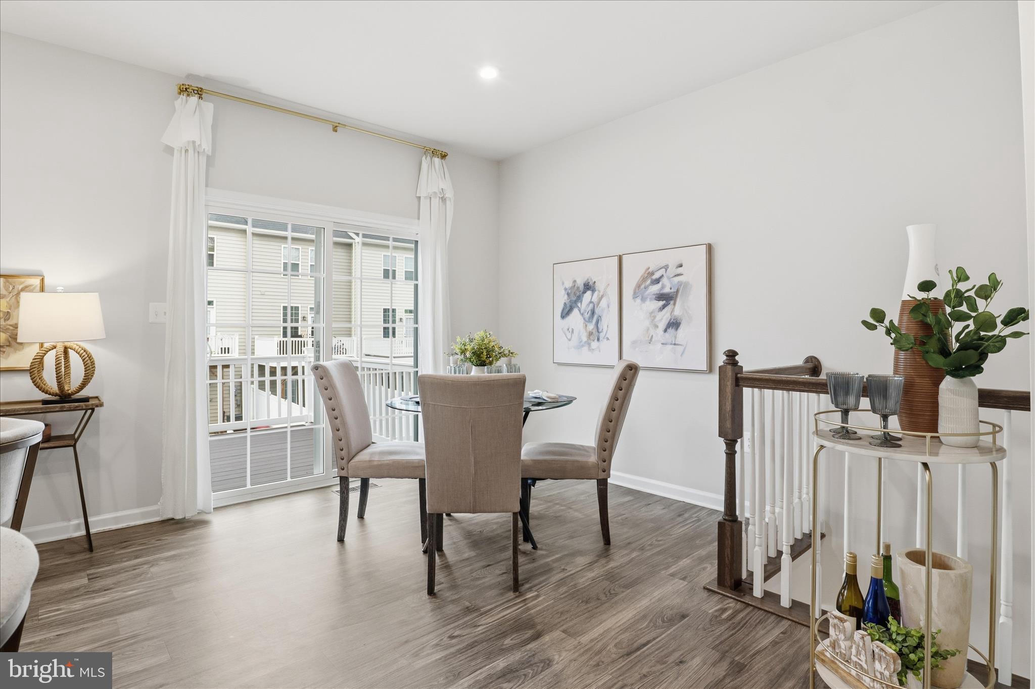 506 View Point Way Fredericksburg, VA 22405 - Photo 14 of 39 a view of a dining room with furniture and wooden floor