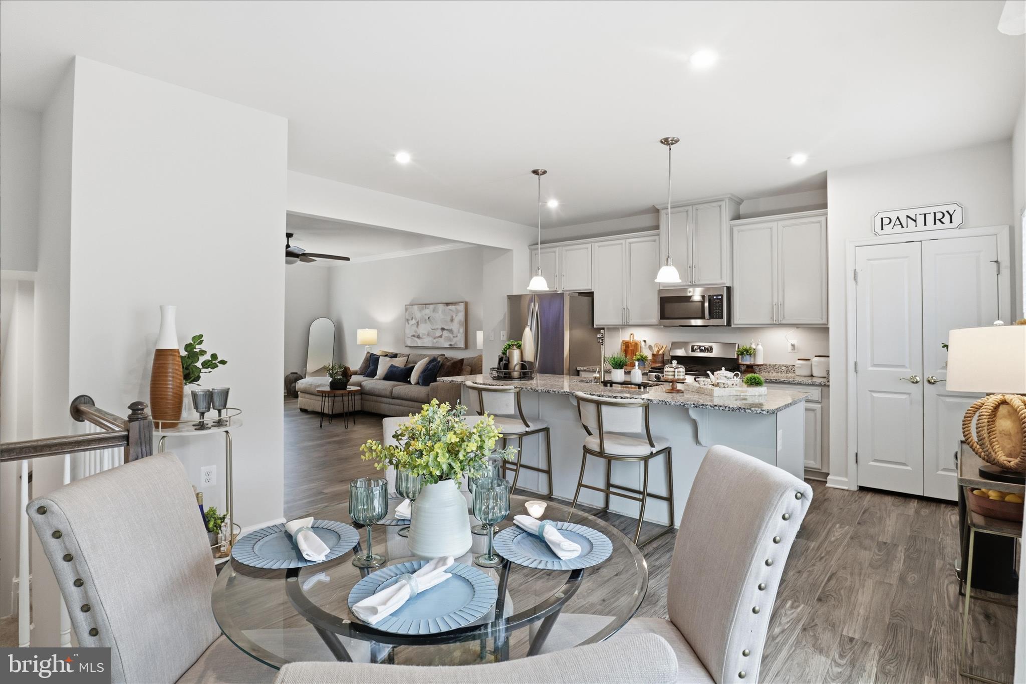506 View Point Way Fredericksburg, VA 22405 - Photo 15 of 39 a kitchen with sink refrigerator dining table and chairs