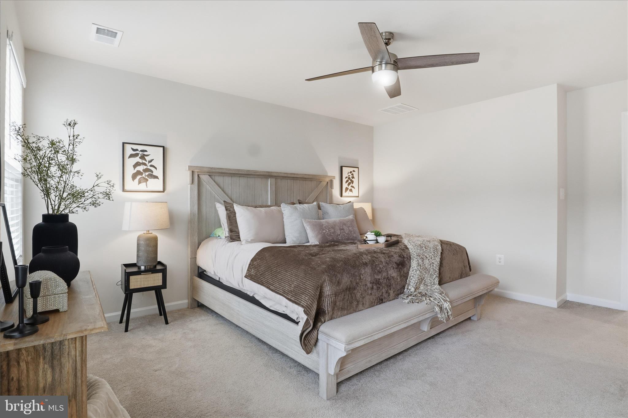 506 View Point Way Fredericksburg, VA 22405 - Photo 18 of 39 a spacious bedroom with a bed and a couch