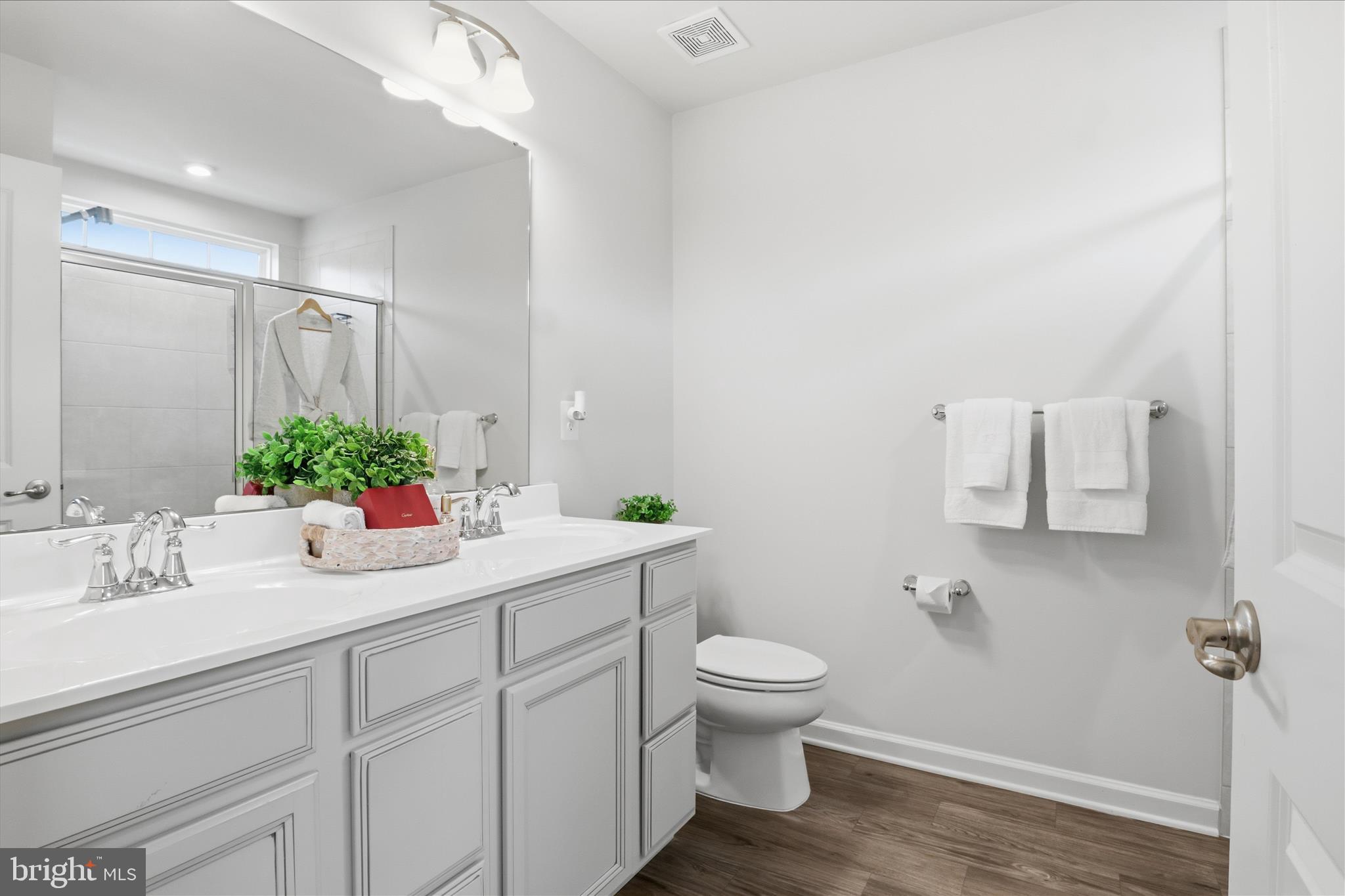 506 View Point Way Fredericksburg, VA 22405 - Photo 20 of 39 a bathroom with a toilet sink and mirror