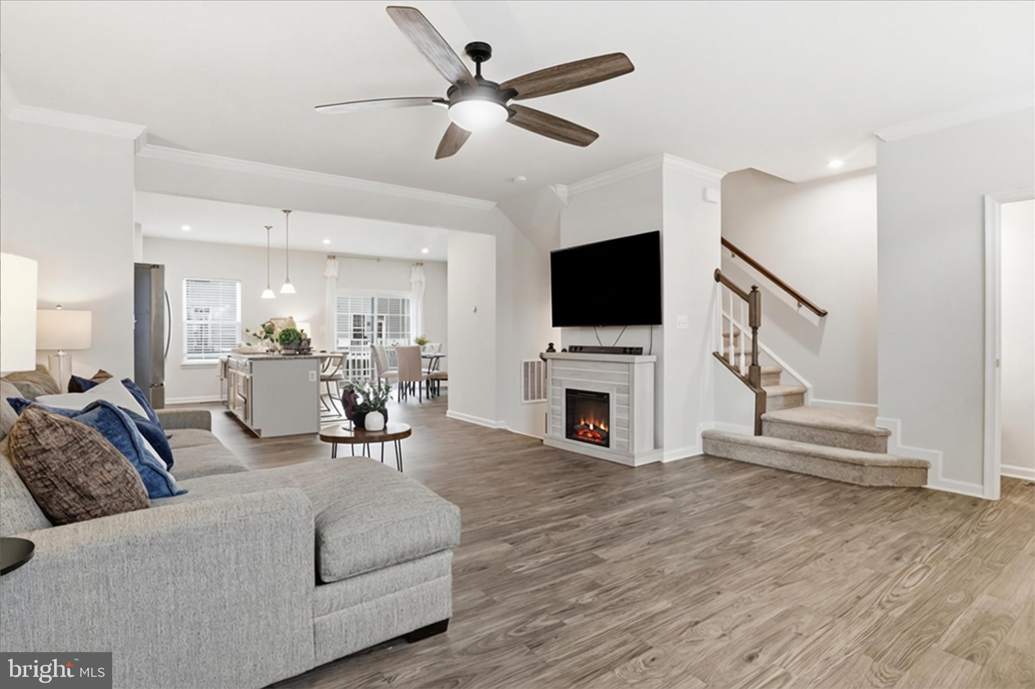 506 View Point Way Fredericksburg, VA 22405 - Photo 6 of 39 a living room with furniture a fireplace and a flat screen tv
