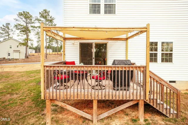 a view of a brick house with a large window
