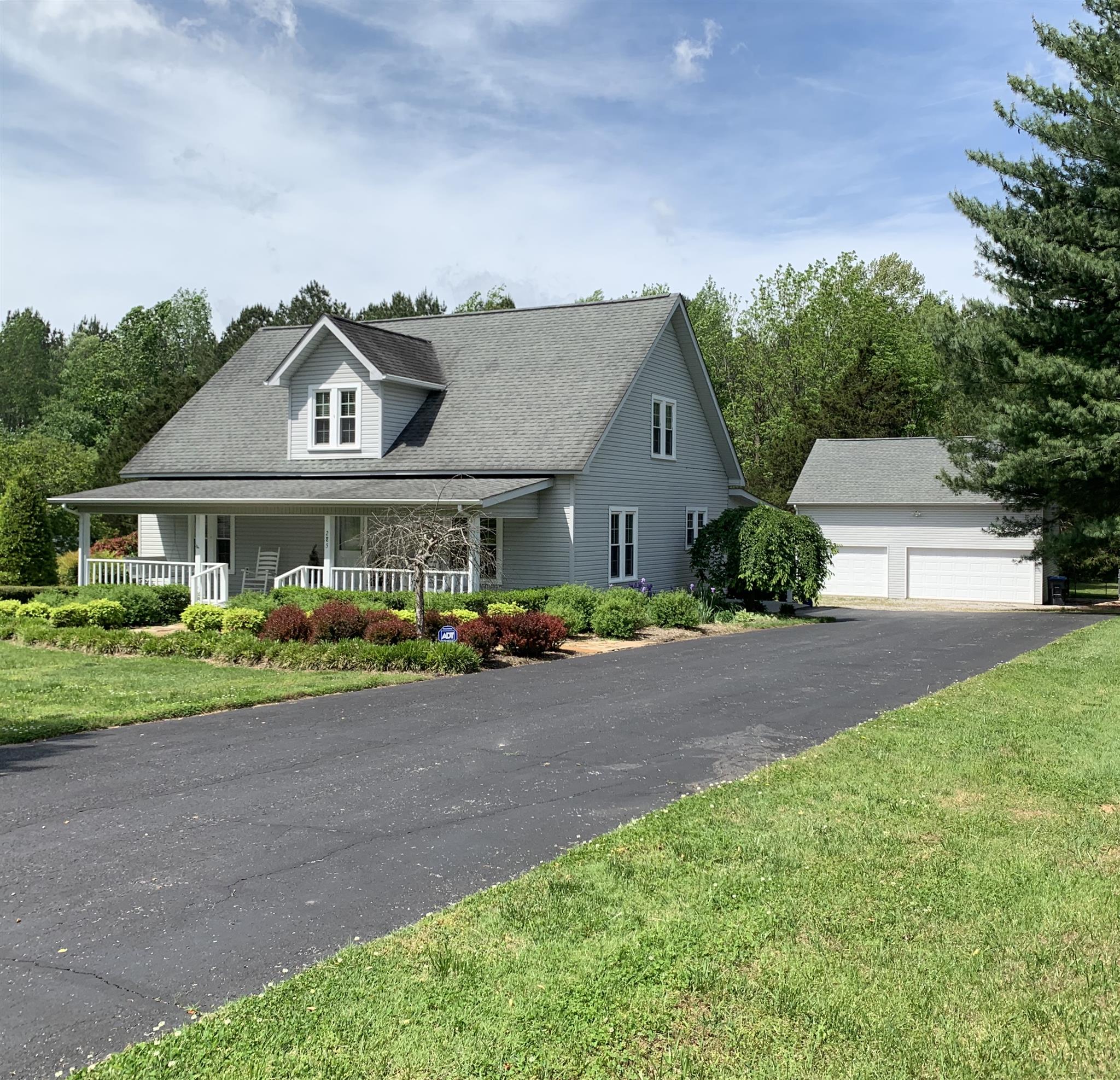 The large 3-car detached garage features an unfinished upstairs for lots of storage.