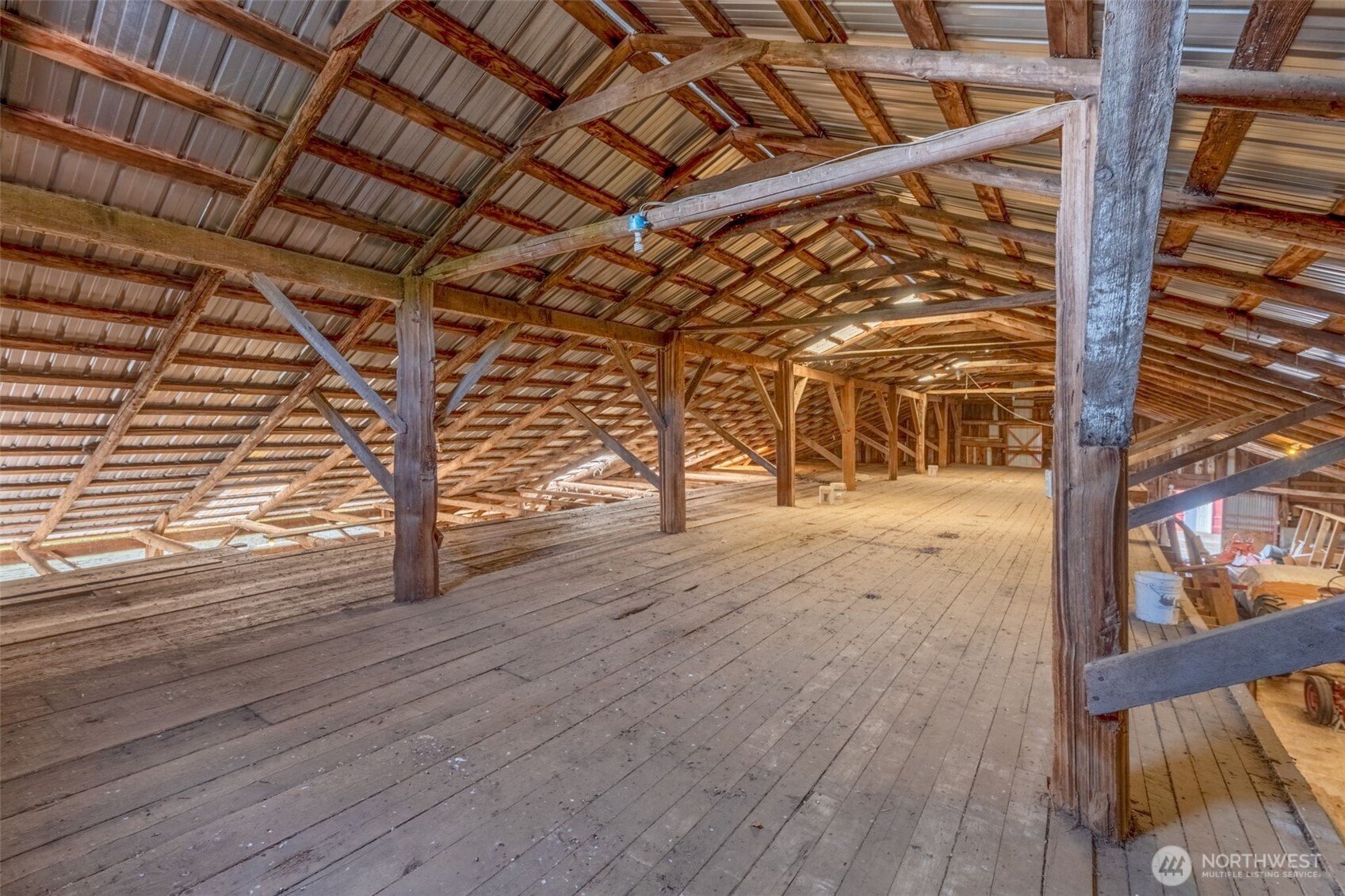 628 East Valley Road Skamokawa, WA 98647 - Photo 10 of 39 a view of an empty room with wooden floor