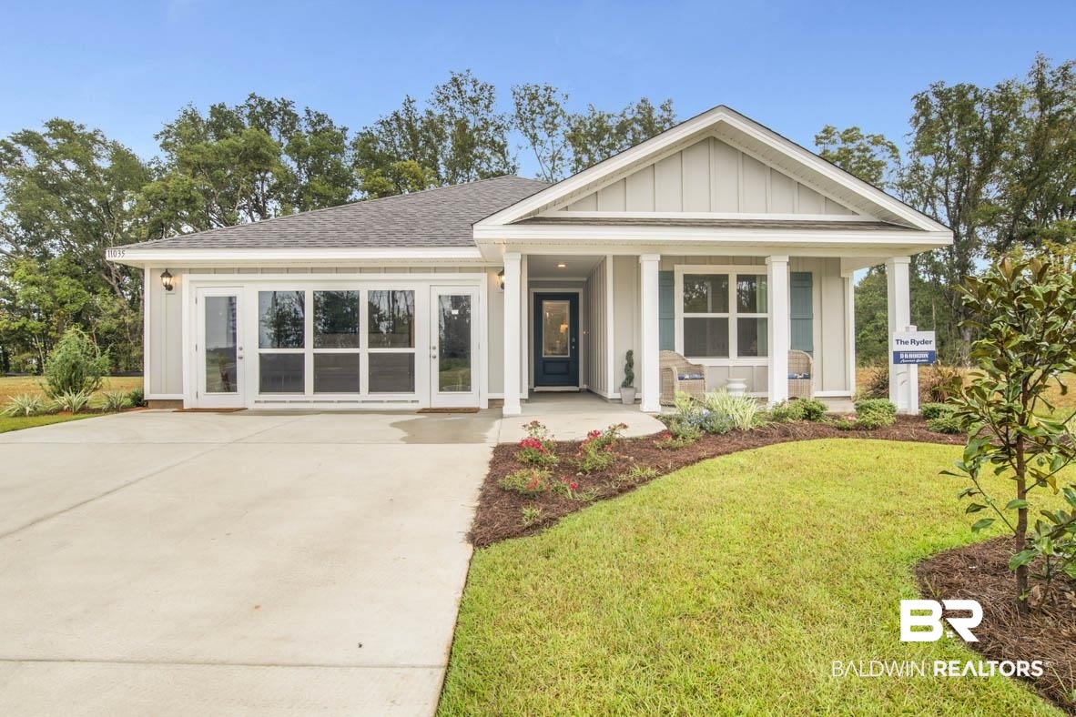 1235 Hayward Loop Foley, AL 36535 - Photo 7 of 26 View of front facade featuring a porch and a front yard