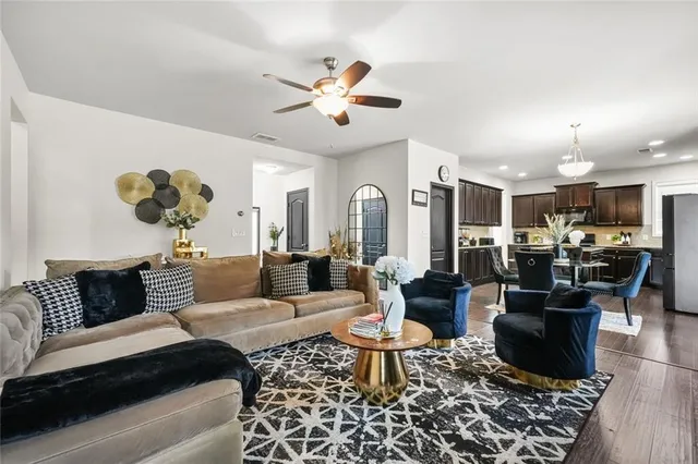 a view of a dining room with furniture and wooden floor