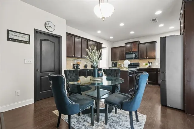 a view of a livingroom with furniture and a window