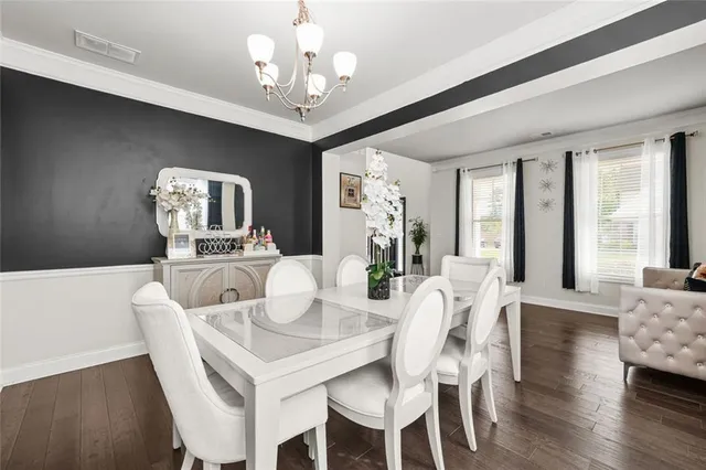 a kitchen with stainless steel appliances granite countertop a sink and a stove