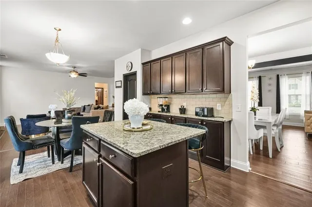 a view of entryway livingroom and hall with wooden floor