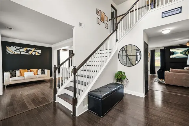 an empty room with closet and mirror